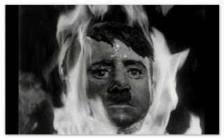 An image of Hitlers head on fire from the film They Saved Hitler's Brain