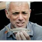 Image of a baby Goliath Tigerfish held by Jeremy Wade