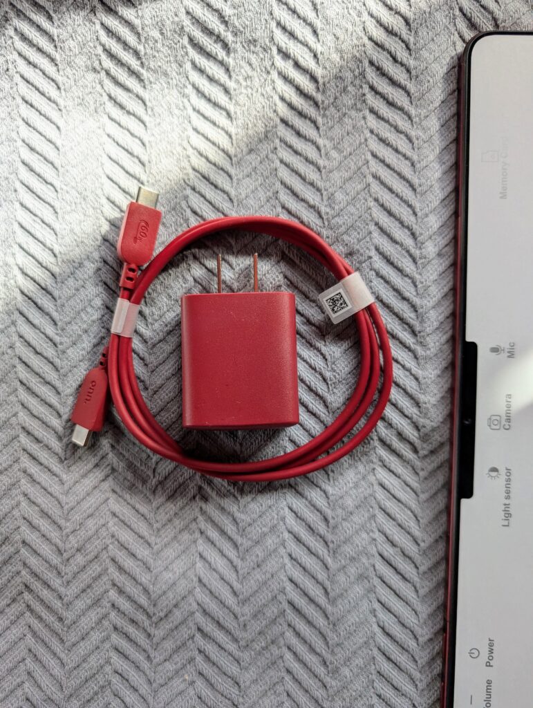 The red charging brick and red USB C cable of the onn. 12.1" Tablet Pro 128GB (2024 Model)